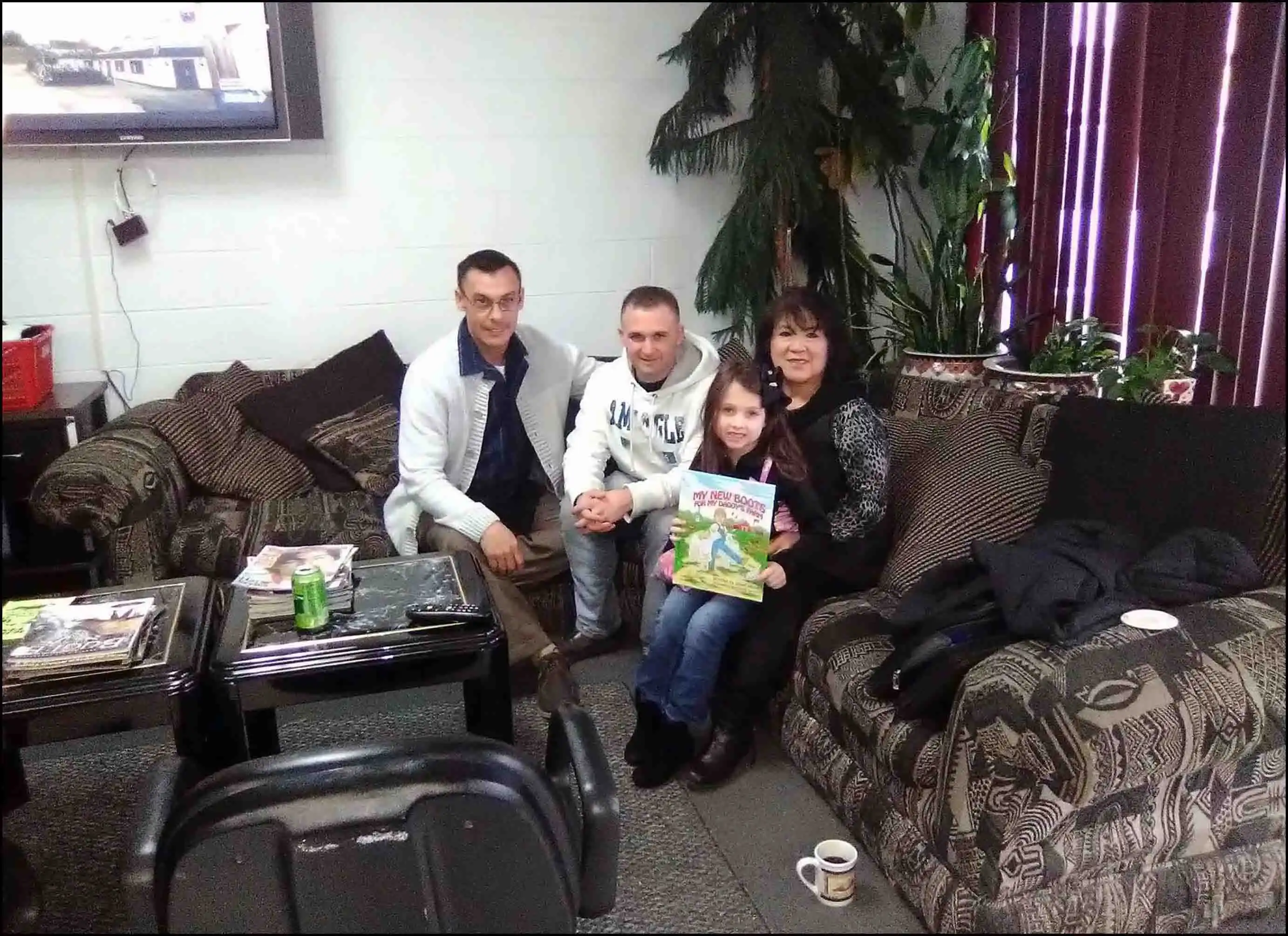 Book Author & Veteran David Haave with soldiers & families at Mrs. Kim's barbershop St. Robert MO... -- David Haave